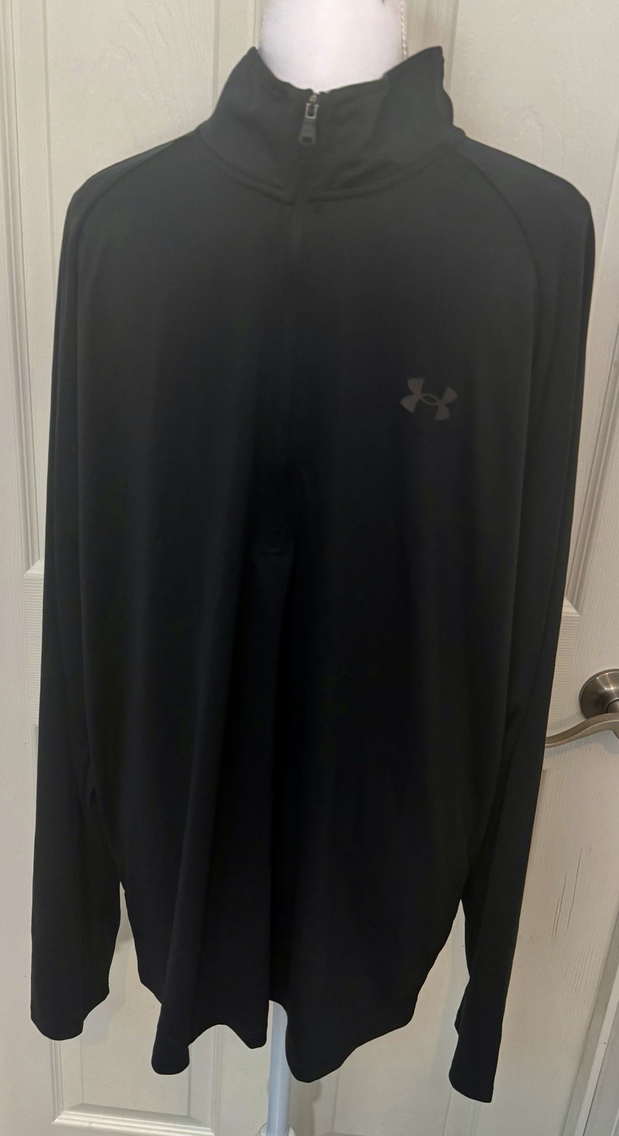 This is a Men’s Under Armour Tech 1/2 Zip Long-Sleeve Pullover in Black.